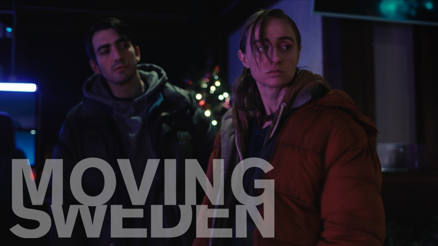 man och kvinna i täckjackor i mörker.