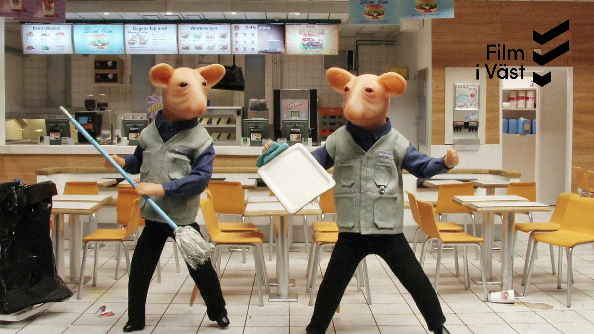 två möss med städkläder dansar i matsal